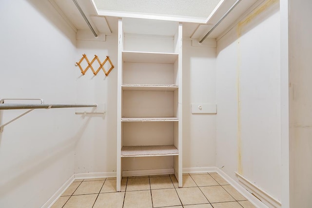 walk in closet featuring light tile patterned floors