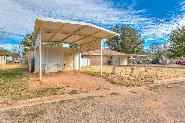 view of outbuilding with a carport