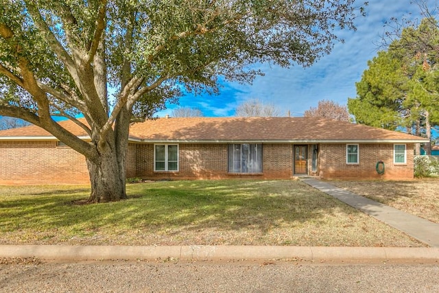 single story home featuring a front yard