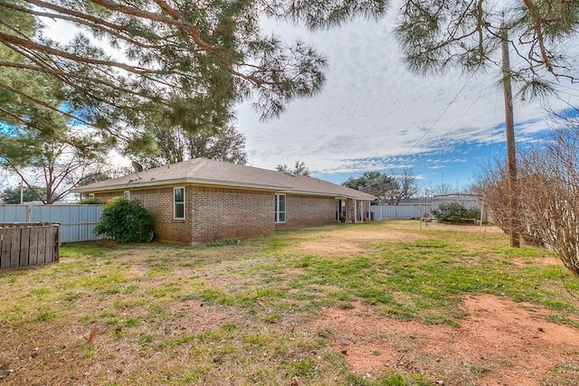 view of property exterior with a lawn