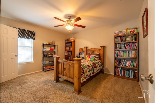 carpeted bedroom featuring baseboards and ceiling fan
