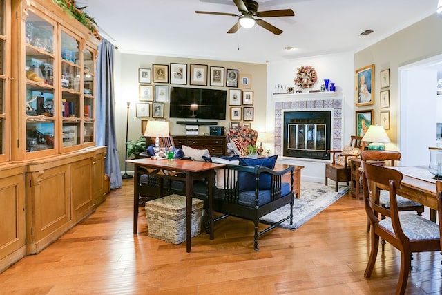 4929 Bermuda Dr, San Angelo, TX 76904 - living room with ceiling fan, light wood-type flooring, and a tiled fireplace