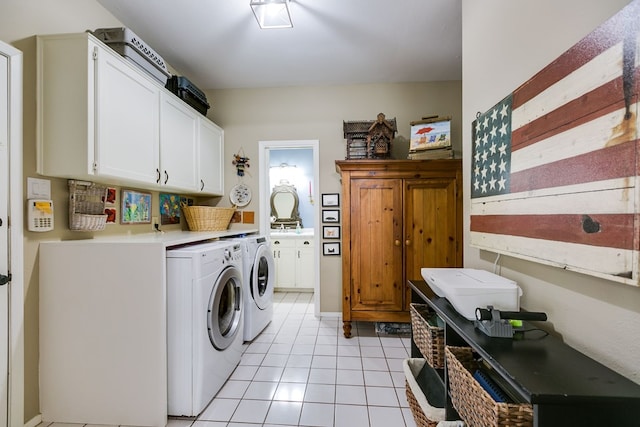 4929 Bermuda Dr, San Angelo, TX 76904 - clothes washing area with cabinet space, independent washer and dryer, and light tile patterned floors