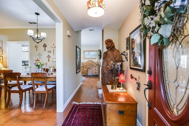 4929 Bermuda Dr, San Angelo, TX 76904 - entrance foyer featuring hardwood / wood-style floors, baseboards, and a chandelier