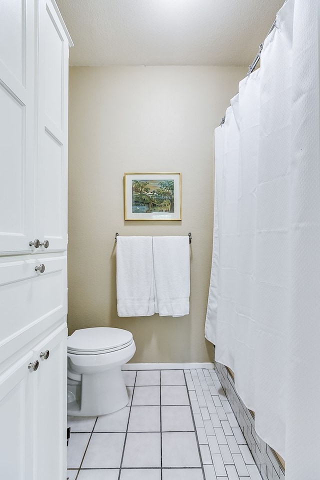 4929 Bermuda Dr, San Angelo, TX 76904 - bathroom featuring toilet and tile patterned floors
