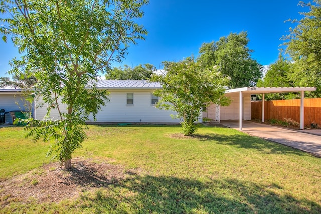 2609 W Harris Ave, San Angelo, TX 76901 - view of yard with concrete driveway and an attached carport