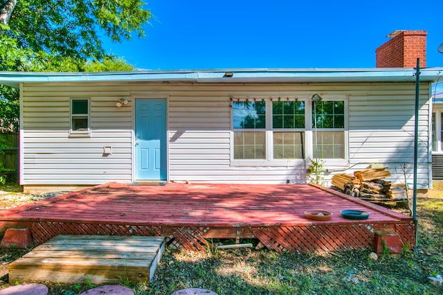 2609 W Harris Ave, San Angelo, TX 76901 - rear view of property with a deck and a chimney