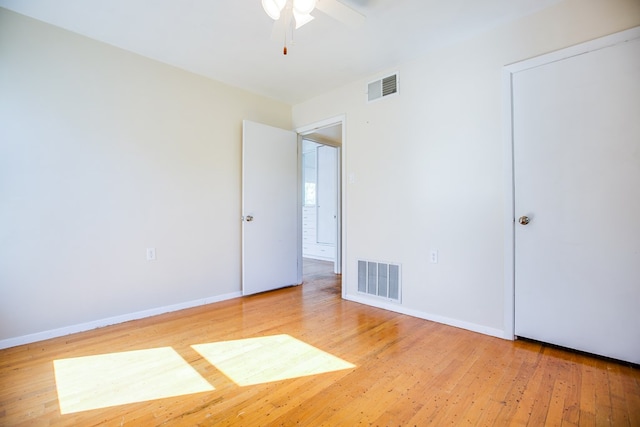 2609 W Harris Ave, San Angelo, TX 76901 - unfurnished bedroom featuring light wood finished floors and ceiling fan