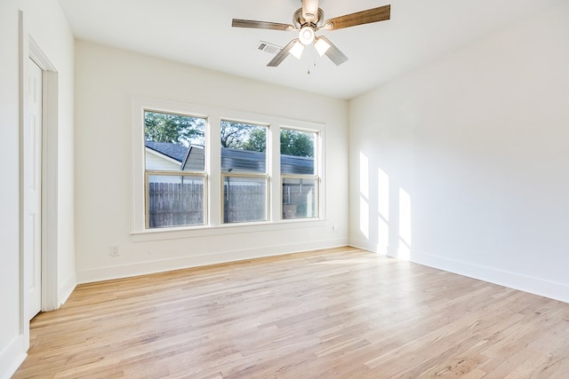 spare room with ceiling fan and light hardwood / wood-style floors