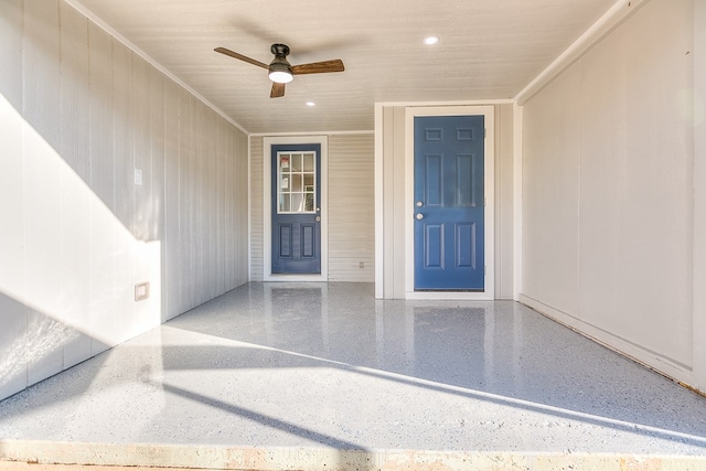 doorway to property featuring ceiling fan