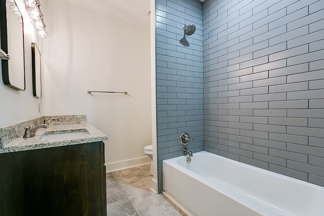 full bathroom featuring vanity, tiled shower / bath combo, tile patterned floors, and toilet