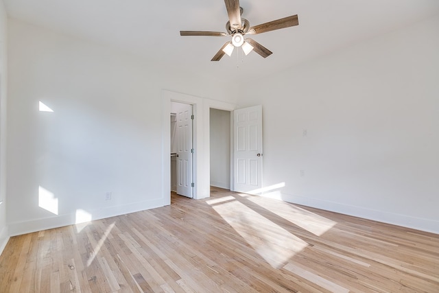 empty room featuring ceiling fan and light wood-type flooring