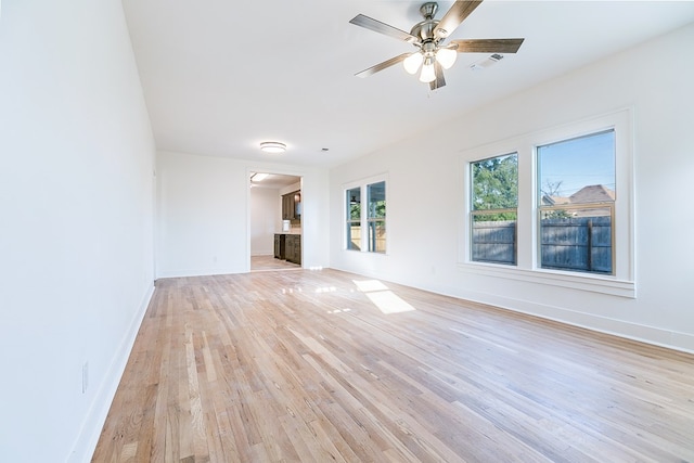 unfurnished living room with light hardwood / wood-style floors and ceiling fan