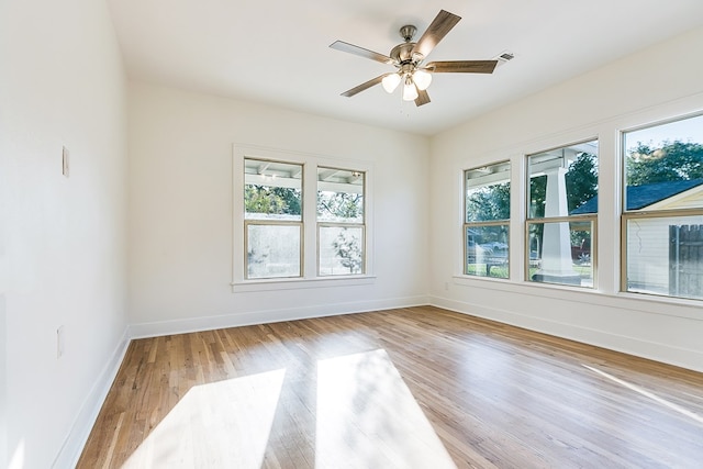 spare room featuring ceiling fan and light wood-type flooring