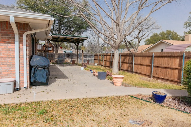 view of yard featuring a fenced backyard and a patio