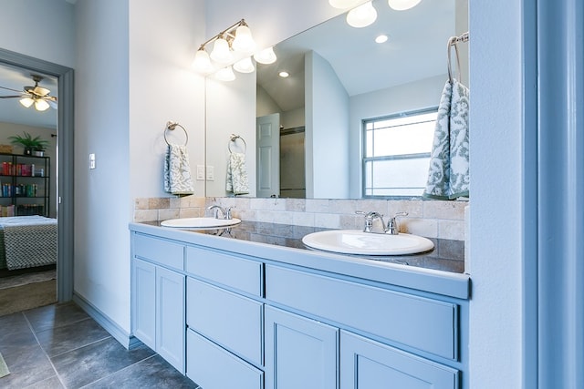 2873 Joshua St, San Angelo, TX 76905 - bathroom with double vanity, ensuite bath, a ceiling fan, and baseboards
