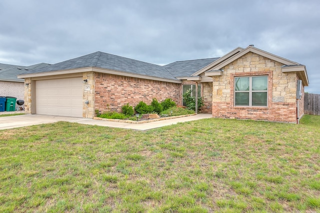 2873 Joshua St, San Angelo, TX 76905 - ranch-style home with concrete driveway, an attached garage, and stone siding