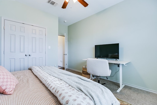 2873 Joshua St, San Angelo, TX 76905 - carpeted bedroom with baseboards, a closet, and ceiling fan