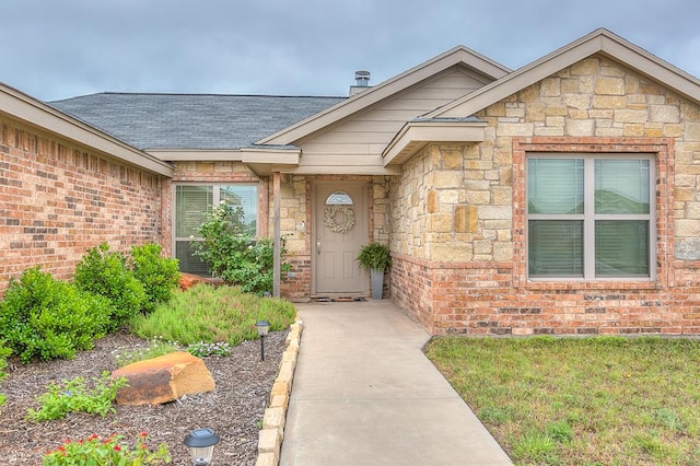 2873 Joshua St, San Angelo, TX 76905 - property entrance with roof with shingles and stone siding