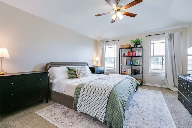 2873 Joshua St, San Angelo, TX 76905 - carpeted bedroom with a tray ceiling, ceiling fan, and baseboards