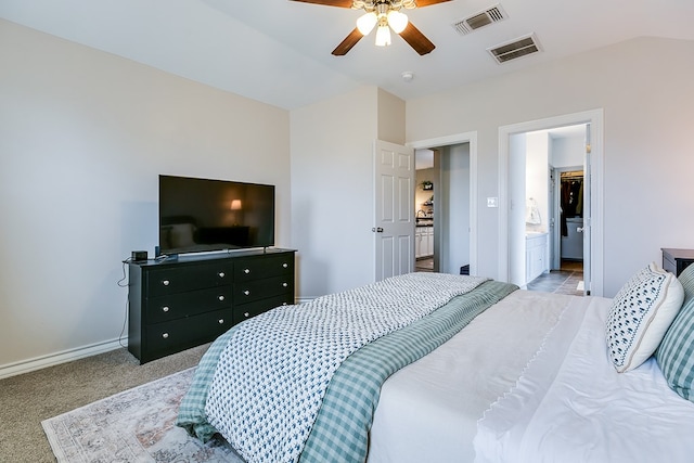 2873 Joshua St, San Angelo, TX 76905 - carpeted bedroom with lofted ceiling, baseboards, a ceiling fan, and connected bathroom
