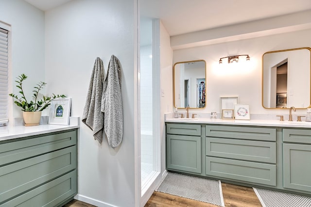 2805 Alta Vista Ln, San Angelo, TX 76904 - bathroom with double vanity, wood finished floors, and a tile shower