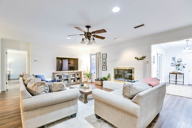 2805 Alta Vista Ln, San Angelo, TX 76904 - living room featuring ceiling fan, crown molding, a brick fireplace, wood finished floors, and recessed lighting