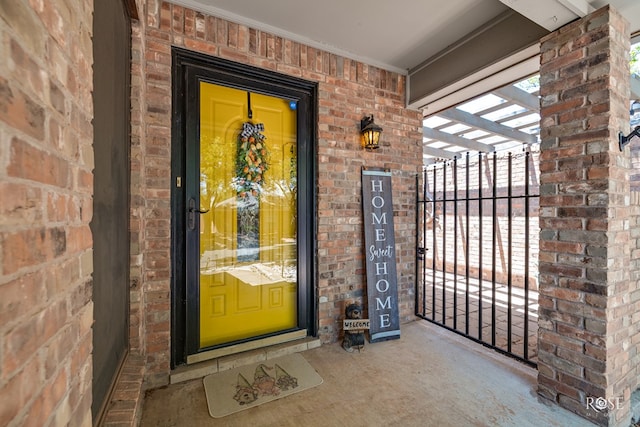entrance to property with brick siding