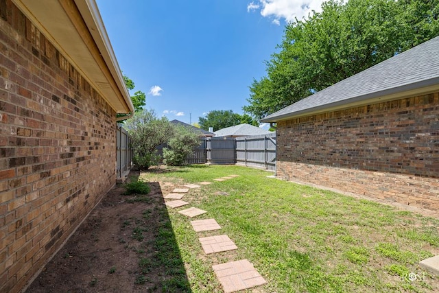 view of yard with a fenced backyard