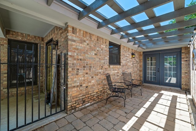 view of patio / terrace featuring a pergola and french doors