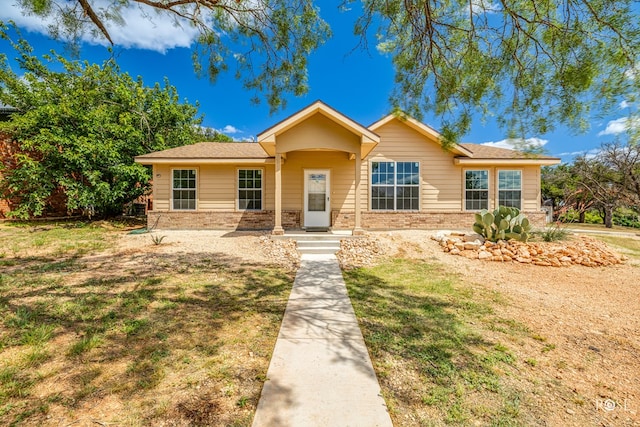 ranch-style home with a front yard