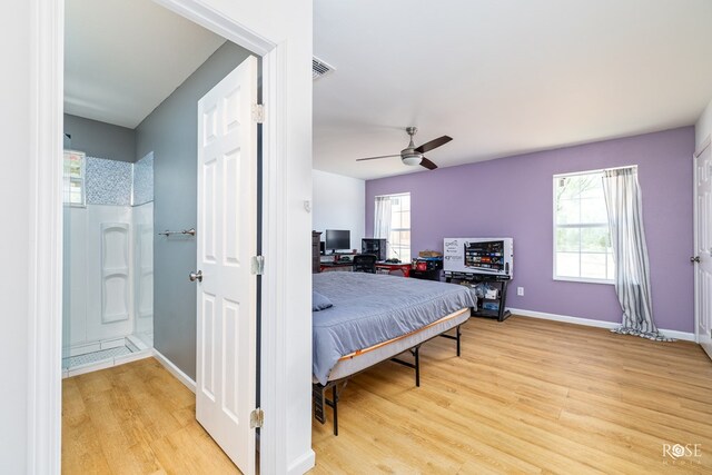 bedroom featuring multiple windows, ceiling fan, and light hardwood / wood-style floors