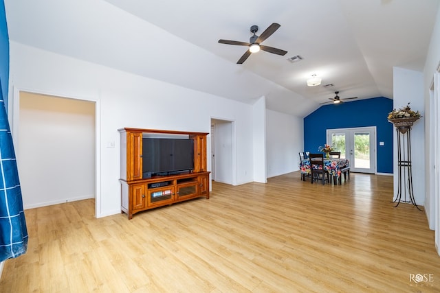 living room with vaulted ceiling, ceiling fan, and light hardwood / wood-style flooring