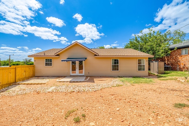 rear view of property featuring french doors