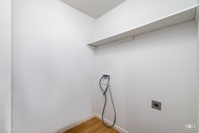 laundry area with hardwood / wood-style flooring, washer hookup, and hookup for an electric dryer