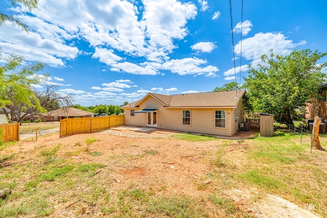 back of house featuring central AC unit and a patio area