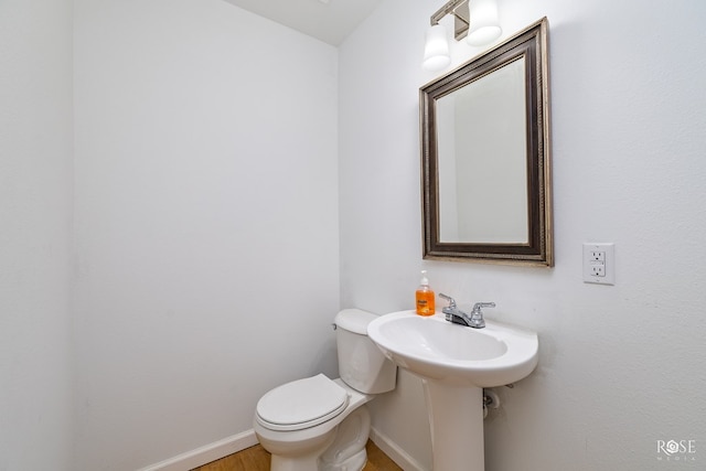 bathroom with sink and toilet