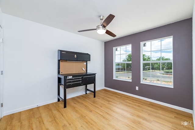 miscellaneous room with ceiling fan and light wood-type flooring