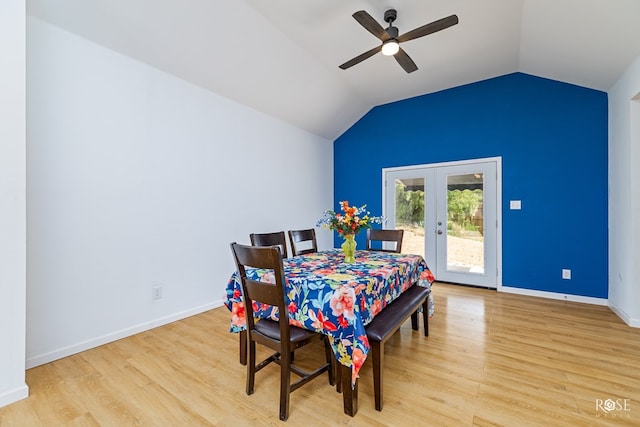 dining space with french doors, ceiling fan, lofted ceiling, and light wood-type flooring