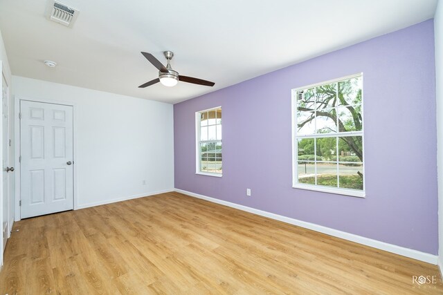 unfurnished room with light hardwood / wood-style floors and ceiling fan