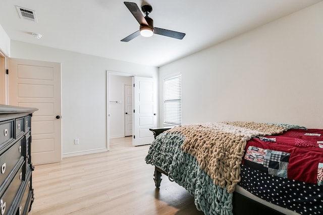 bedroom with light hardwood / wood-style flooring and ceiling fan