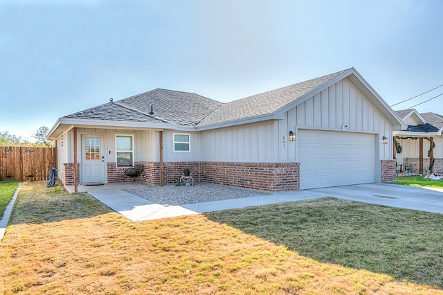 view of front of property with a garage and a front yard