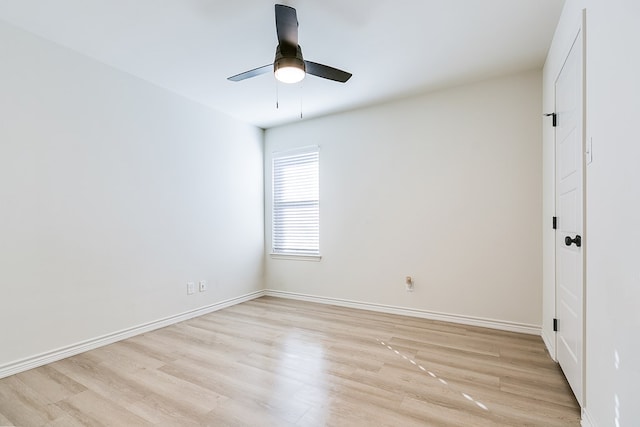 empty room with ceiling fan and light hardwood / wood-style floors