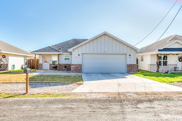 view of front of property featuring a garage and a front yard