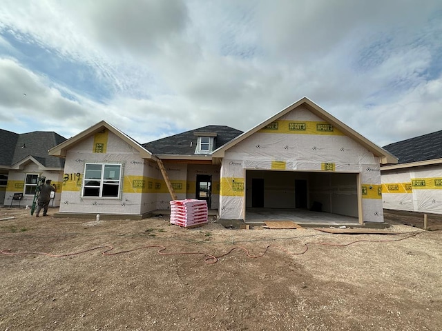 property in mid-construction featuring a garage