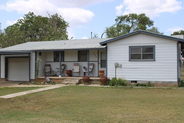 ranch-style house featuring a porch, a garage, and a front lawn