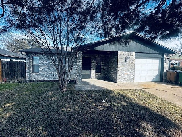 ranch-style home with a garage and a front yard