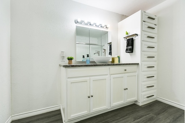 bathroom with vanity, hardwood / wood-style floors, and a shower with shower door