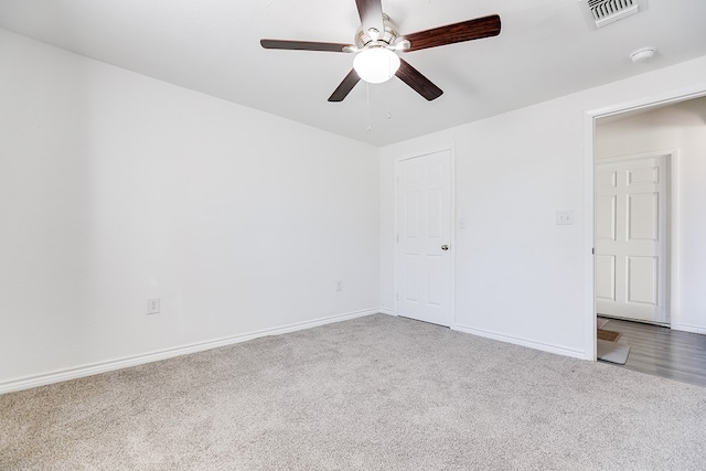 spare room with ceiling fan and carpet flooring