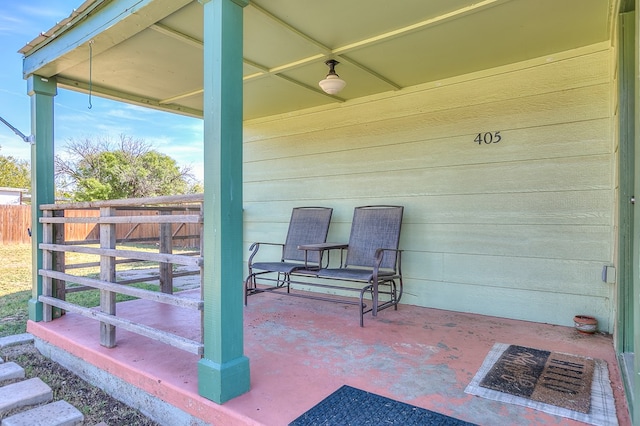 view of patio featuring fence